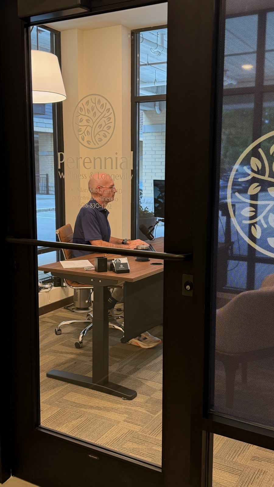 Dr. Allan Mottram working in his Perennial clinic office